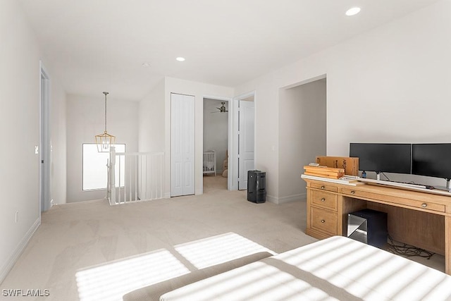 bedroom with a closet and light colored carpet