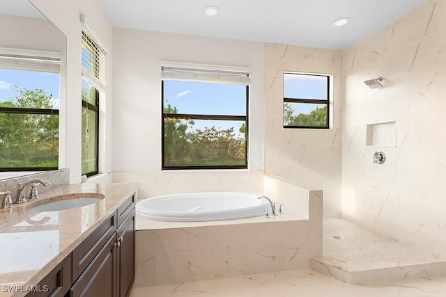 bathroom featuring vanity and separate shower and tub