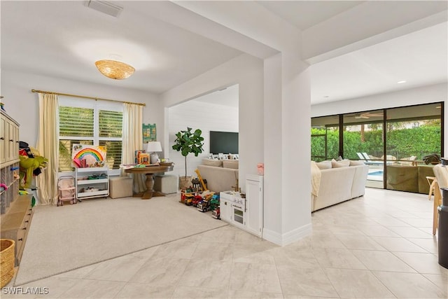 playroom featuring light colored carpet