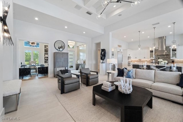 tiled living room featuring a high ceiling