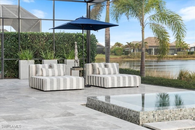 view of patio / terrace with a water view and an outdoor hangout area