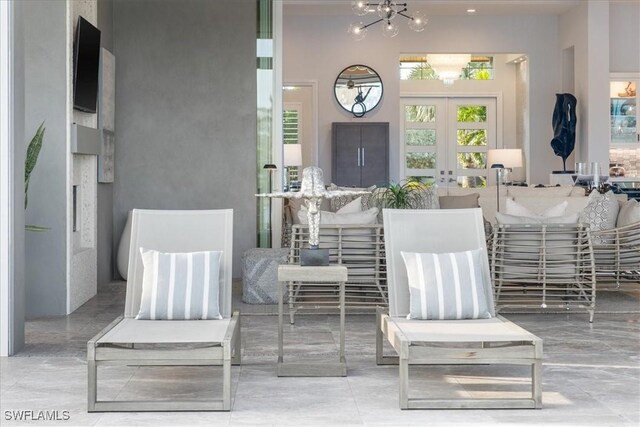 view of patio featuring french doors and ceiling fan