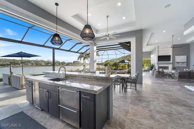 interior space featuring a water view, glass enclosure, ceiling fan, and a wet bar