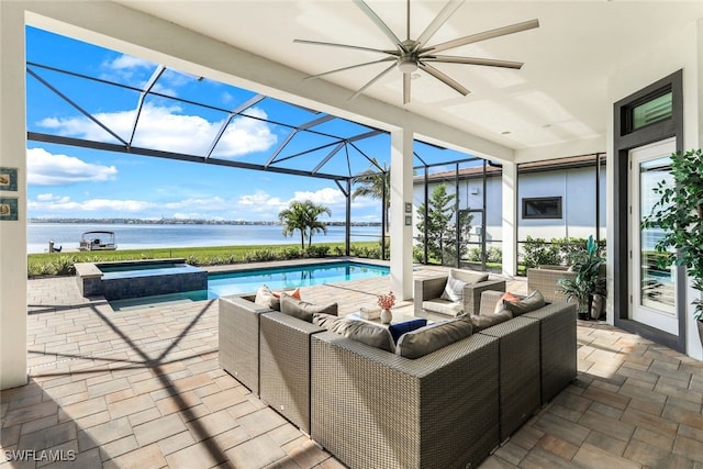 view of patio with an outdoor hangout area, a water view, glass enclosure, and a pool with hot tub