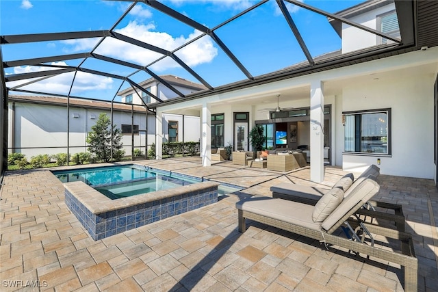 view of swimming pool with an in ground hot tub, an outdoor living space, ceiling fan, glass enclosure, and a patio area