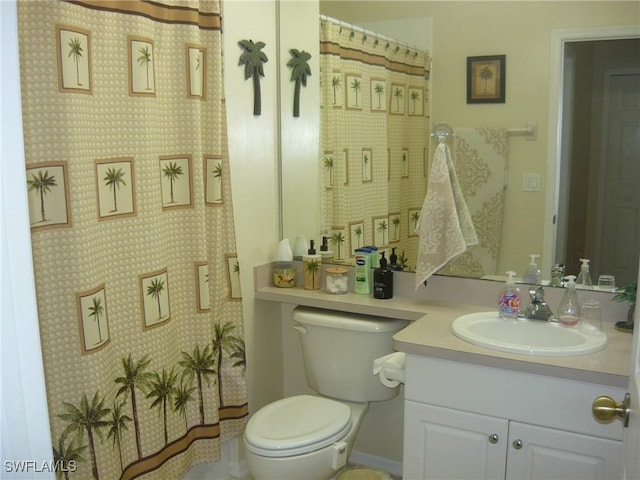 bathroom featuring vanity and toilet