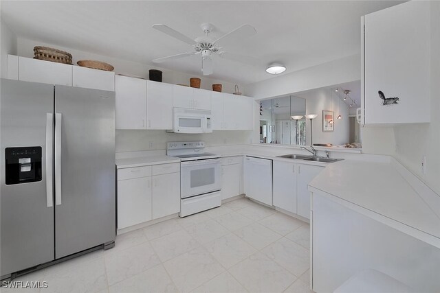 kitchen with white cabinets, white appliances, ceiling fan, and sink