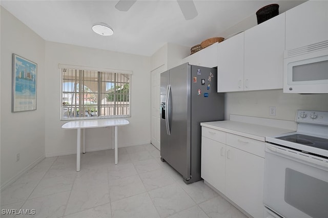 kitchen featuring white appliances, white cabinetry, and ceiling fan