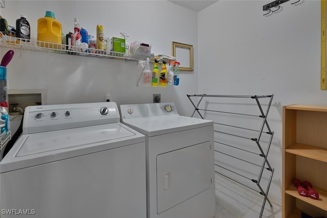 laundry area featuring washer and dryer and laundry area