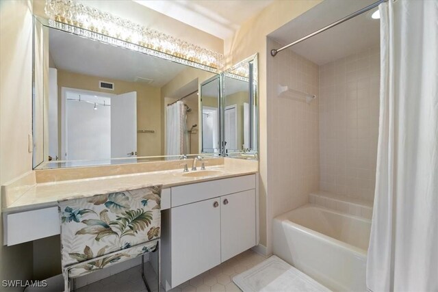 bathroom featuring tile patterned floors, vanity, and shower / bath combination with curtain