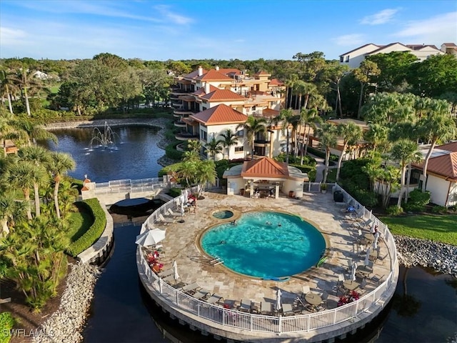 view of swimming pool with a water view