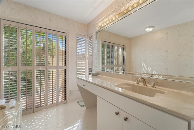 bathroom with tile patterned floors and vanity