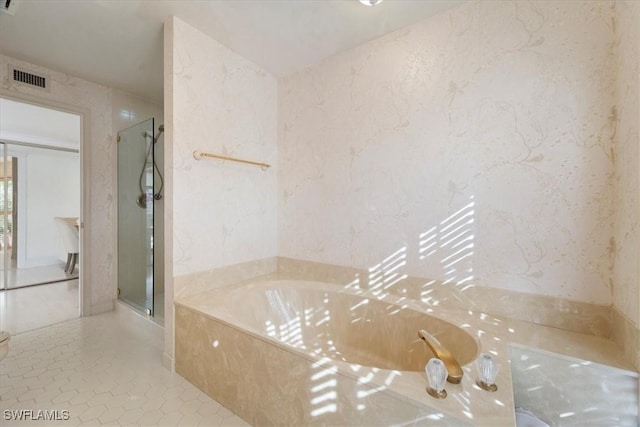 bathroom with tile patterned floors and plus walk in shower