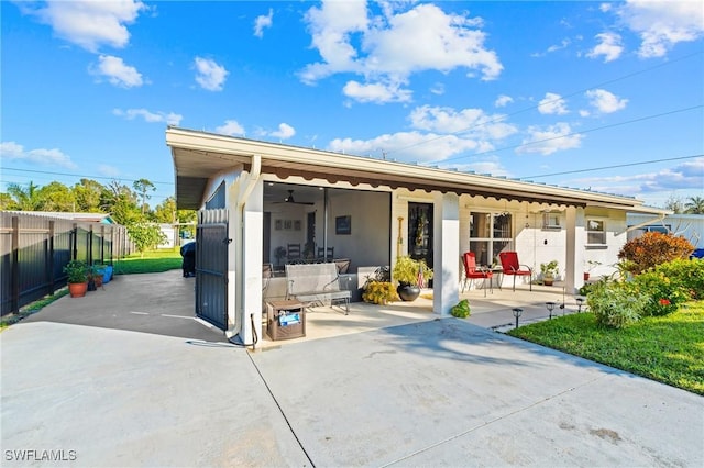 back of property featuring a patio