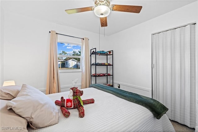 carpeted bedroom featuring ceiling fan