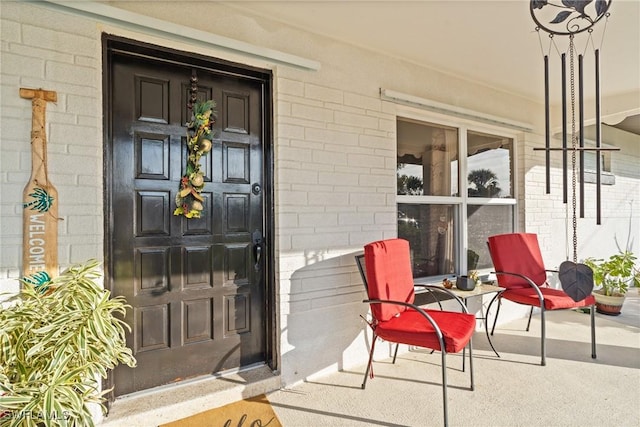 entrance to property featuring covered porch