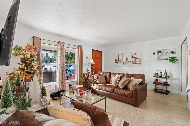 living room featuring built in shelves