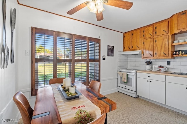 kitchen featuring white range with electric cooktop, ceiling fan, white cabinetry, and backsplash