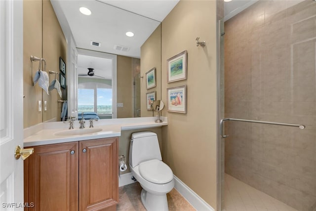 bathroom with ceiling fan, toilet, a shower with shower door, and vanity