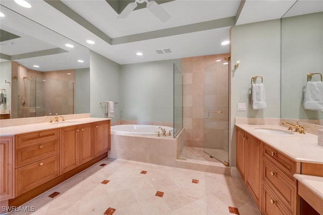 bathroom with plus walk in shower, vanity, and ceiling fan