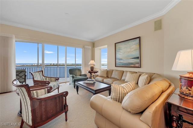 living room with a water view, crown molding, and light carpet