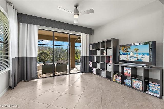 interior space with ceiling fan and light tile patterned floors