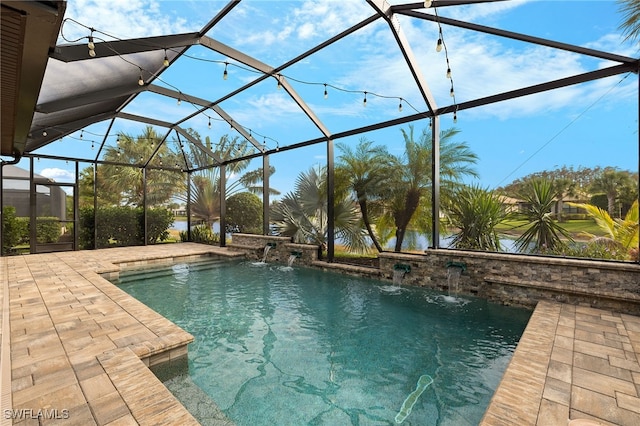 outdoor pool featuring glass enclosure and a patio area