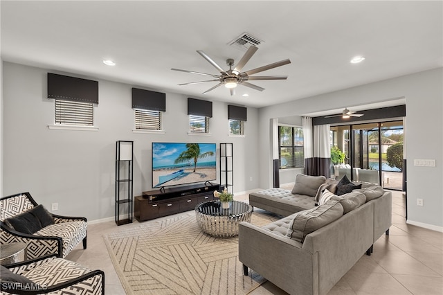 living room with ceiling fan and light tile patterned floors