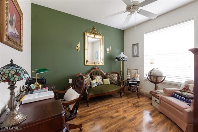 sitting room featuring ceiling fan and wood-type flooring