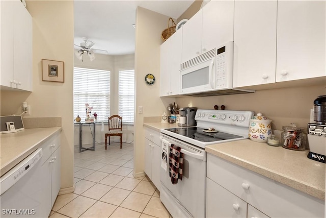 kitchen featuring white cabinets, ceiling fan, and white appliances