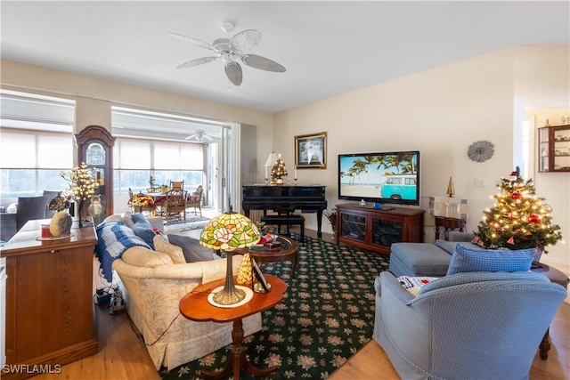 living room with hardwood / wood-style floors and ceiling fan