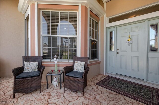 2320 Palo Duro Blvd, North Fort Myers, FL 33917 - entrance to property featuring a porch and stucco siding