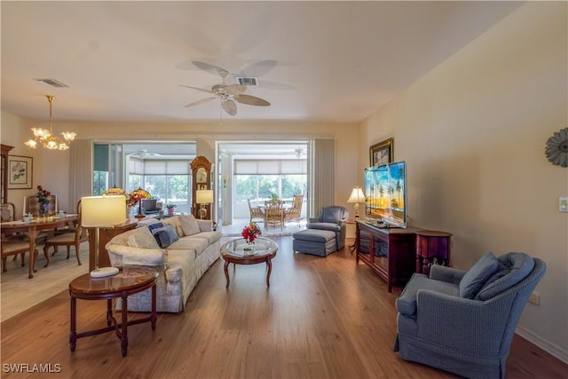 2320 Palo Duro Blvd, North Fort Myers, FL 33917 - living area featuring a ceiling fan, wood finished floors, and a chandelier