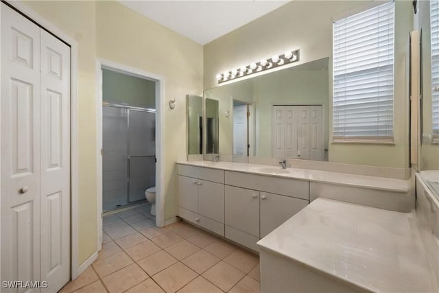 2320 Palo Duro Blvd, North Fort Myers, FL 33917 - full bath with a closet, double vanity, a shower stall, and tile patterned flooring