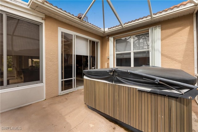 2320 Palo Duro Blvd, North Fort Myers, FL 33917 - view of patio featuring a hot tub and a lanai