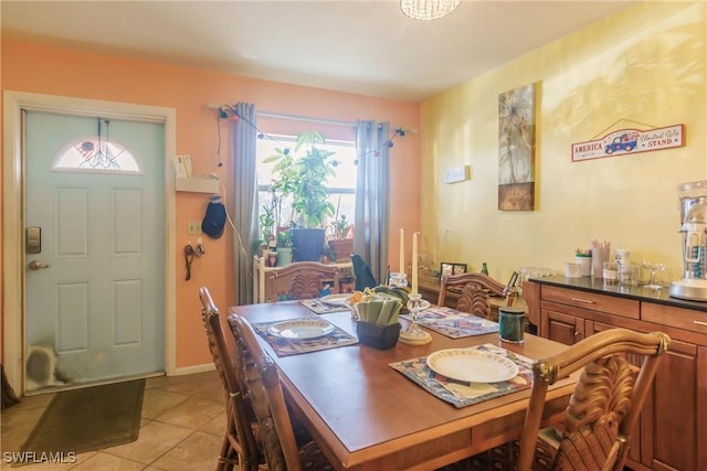 dining area featuring light tile patterned floors