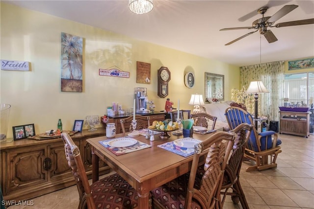 tiled dining space with ceiling fan