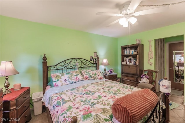 bedroom with ceiling fan and light tile patterned floors