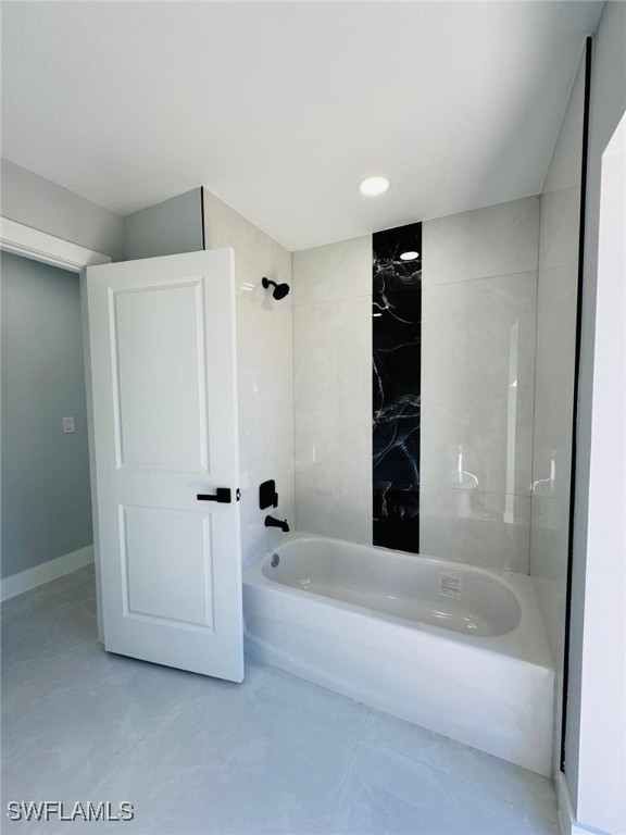 bathroom with washtub / shower combination