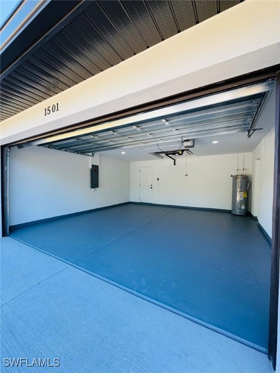 garage featuring electric water heater, electric panel, and a garage door opener