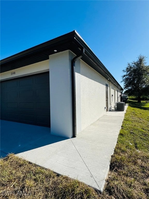 view of property exterior with central AC unit