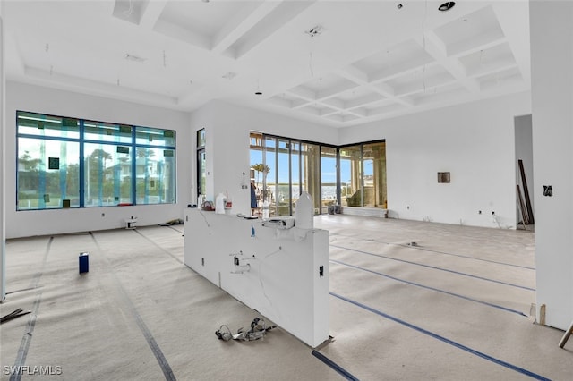 interior space featuring beamed ceiling and coffered ceiling