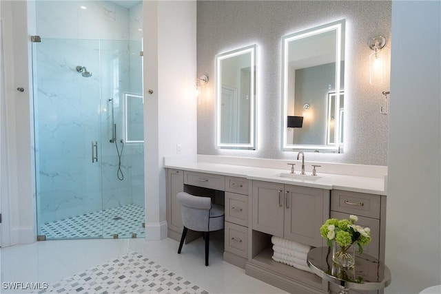 bathroom featuring tile patterned flooring, vanity, and walk in shower