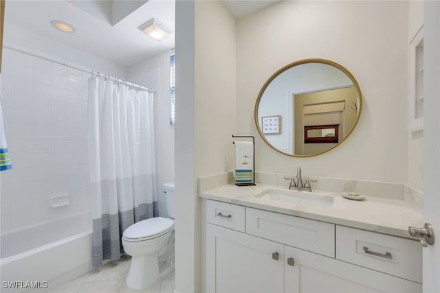 full bathroom featuring tile patterned floors, shower / bath combo with shower curtain, vanity, and toilet