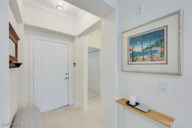 foyer entrance featuring crown molding