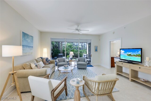 tiled living room featuring ceiling fan