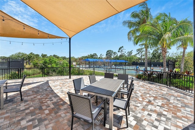 view of patio / terrace with outdoor dining area and fence