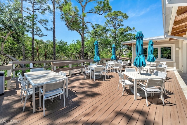 wooden deck featuring outdoor dining space