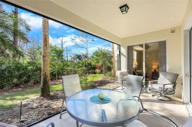 20944 Island Sound Cir Unit 101, Estero, FL 33928 - sunroom with outdoor dining area