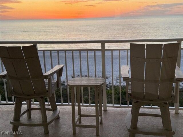 balcony at dusk with a water view